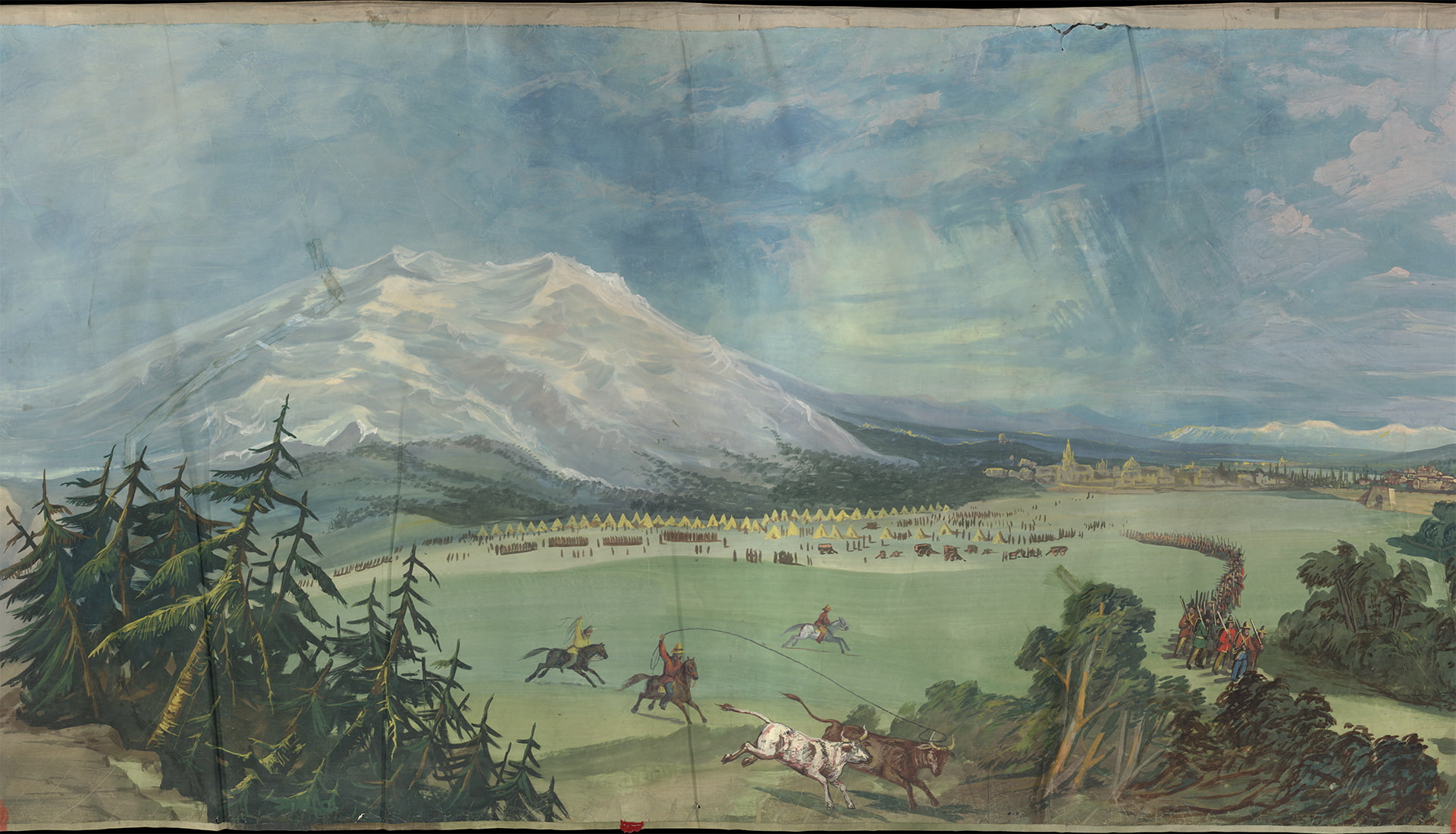 men on horseback chase and lasso cattle