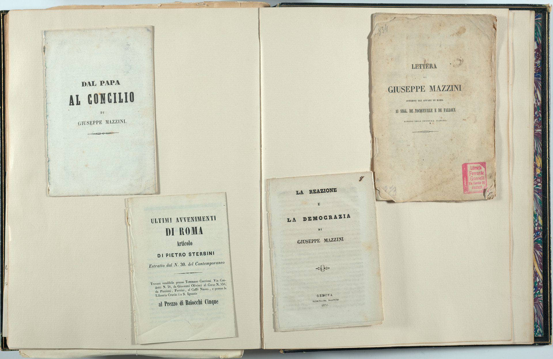 display of Italian-language pamphlets in a scrapbook