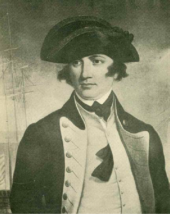 Black and white portrait of curly-haired man with a ship's mast in the background